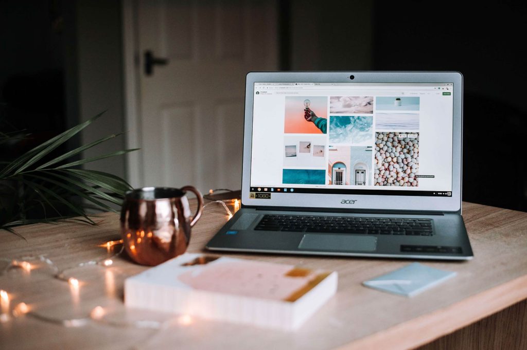 open laptop on wooden table