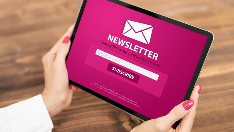 Email Welcome Sequence Hands holding a tablet displaying a newsletter subscription page with a pink background, email input field, and a "Subscribe" button. Sign up now to unlock our exclusive email welcome sequence!