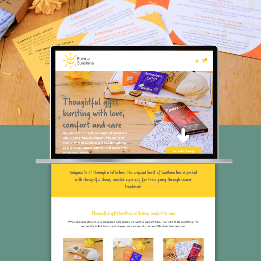 A laptop displaying a website for "Burst of Sunshine", showing thoughtful gifts for those undergoing cancer treatment, surrounded by various gift items and informational pamphlets.