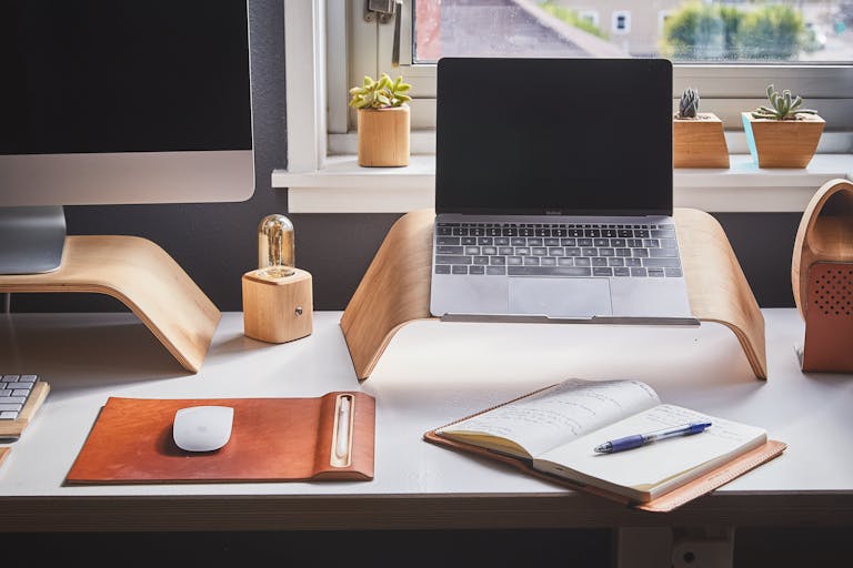 A simple desk scene with an open notebook showing a short list of content themes focused on what to say in your marketing